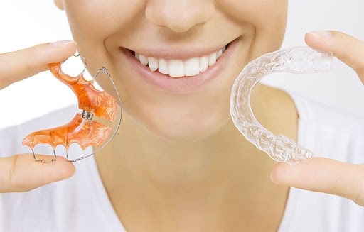 Woman showing different types of retainers